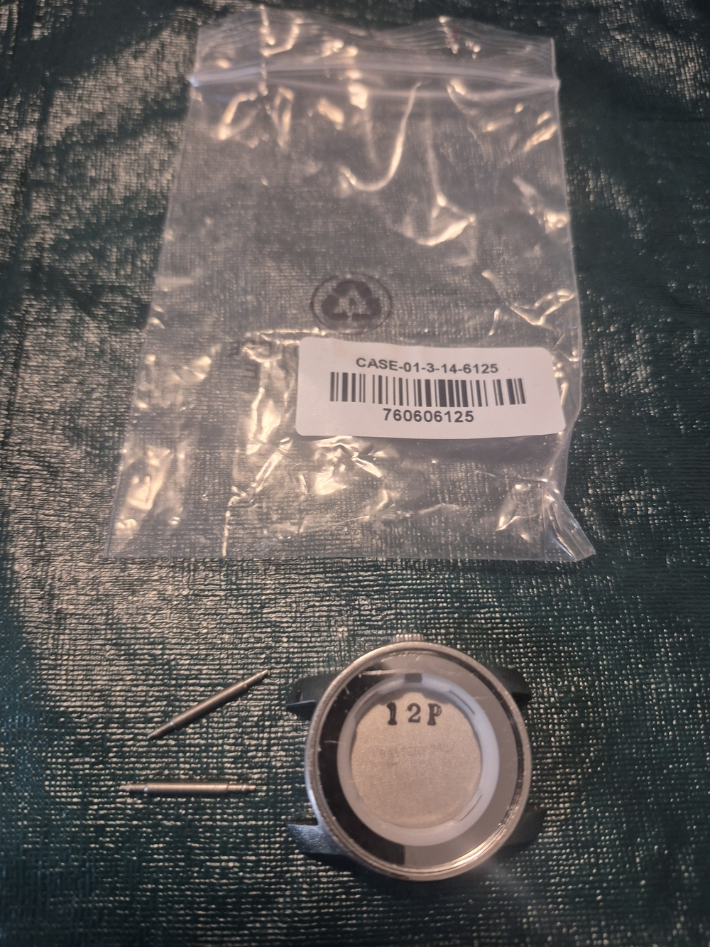 Movado Bold's Silver and White Watch Case Back and Pins